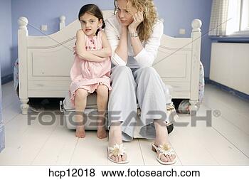 Stock Photo - mother and daughter 
packing suitcase. 
fotosearch - search 
stock photos, 
pictures, images, 
and photo clipart