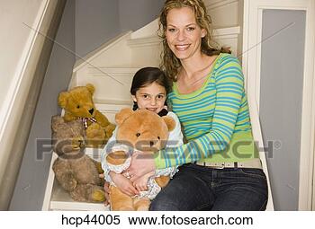 Stock Image - mother and daughter 
playing with teddy 
bears. fotosearch 
- search stock 
photos, pictures, 
images, and photo 
clipart