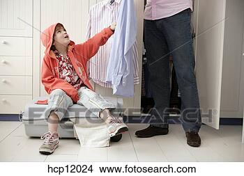 Stock Photo - mother and son 
packing suitcase. 
fotosearch - search 
stock photos, 
pictures, images, 
and photo clipart