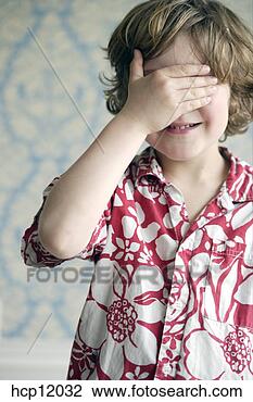 Stock Photo - young boy covering 
his eyes. fotosearch 
- search stock 
photos, pictures, 
images, and photo 
clipart