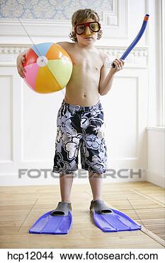 Stock Photo - young boy dressed 
in flippers and 
snorkel. fotosearch 
- search stock 
photos, pictures, 
images, and photo 
clipart