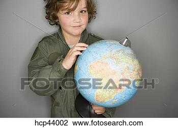 Stock Photo - young boy in jumpsuit 
holding globe. 
fotosearch - search 
stock photos, 
pictures, images, 
and photo clipart