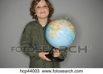 Stock Photo - young boy in jumpsuit 
holding globe. 
fotosearch - search 
stock photos, 
pictures, images, 
and photo clipart