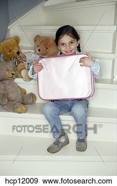 Stock Photograph - young girl playing 
with teddy bears. 
fotosearch - search 
stock photos, 
pictures, images, 
and photo clipart