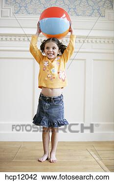 Stock Photo - young girl playing 
with ball. fotosearch 
- search stock 
photos, pictures, 
images, and photo 
clipart