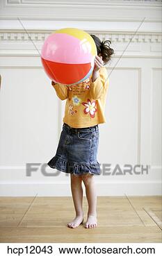 Stock Photo - young girl playing 
with ball. fotosearch 
- search stock 
photos, pictures, 
images, and photo 
clipart
