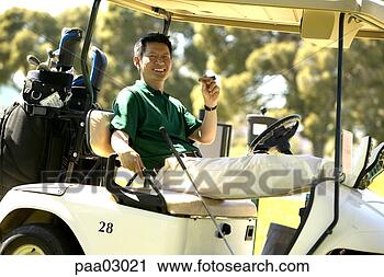 Stock Photography - asian man relaxing 
with cigar in 
golf cart. fotosearch 
- search stock 
photos, pictures, 
images, and photo 
clipart