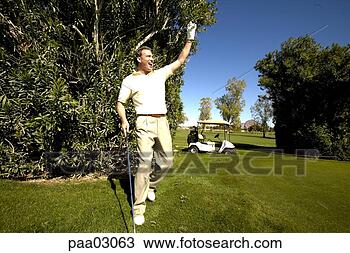 Stock Photo - cheering male 
golfer. fotosearch 
- search stock 
photos, pictures, 
images, and photo 
clipart