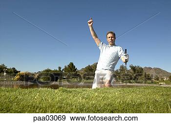 Stock Photograph - cheering male 
golfer. fotosearch 
- search stock 
photos, pictures, 
images, and photo 
clipart