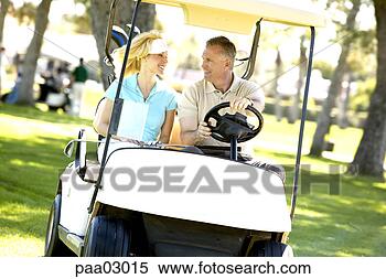 Stock Image - couple driving 
golf cart. fotosearch 
- search stock 
photos, pictures, 
images, and photo 
clipart