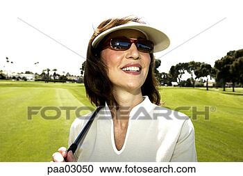Stock Photography - female golfer. 
fotosearch - search 
stock photos, 
pictures, images, 
and photo clipart