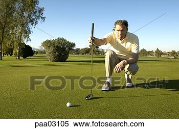 Stock Image - male golfer lining 
up shot. fotosearch 
- search stock 
photos, pictures, 
images, and photo 
clipart