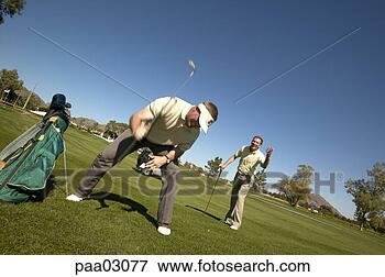 Picture - man beating ground 
with golf club. 
fotosearch - search 
stock photos, 
pictures, images, 
and photo clipart