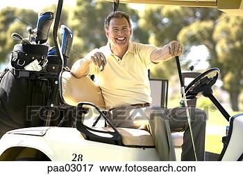 Picture - man driving golf 
cart. fotosearch 
- search stock 
photos, pictures, 
images, and photo 
clipart