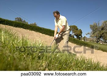 Stock Photo - man hitting golf 
ball out of bunker. 
fotosearch - search 
stock photos, 
pictures, images, 
and photo clipart