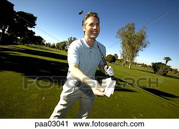 Stock Photography - man holding tee 
card on golf course. 
fotosearch - search 
stock photos, 
pictures, images, 
and photo clipart