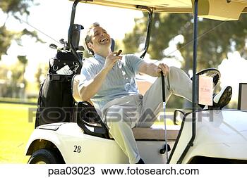 Stock Photo - man relaxing with 
cigar in golf 
cart. fotosearch 
- search stock 
photos, pictures, 
images, and photo 
clipart