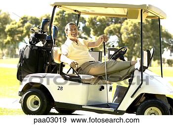 Stock Photograph - man relaxing in 
golf cart. fotosearch 
- search stock 
photos, pictures, 
images, and photo 
clipart