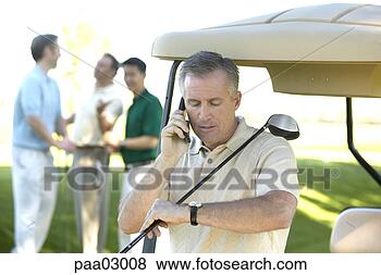 Stock Photo - man talking on 
cell phone at 
golf course. fotosearch 
- search stock 
photos, pictures, 
images, and photo 
clipart
