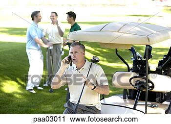 Stock Photography - man talking on 
cell phone at 
golf course. fotosearch 
- search stock 
photos, pictures, 
images, and photo 
clipart