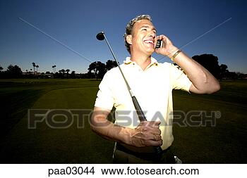 Stock Photo - man talking on 
cell phone on 
golf course. fotosearch 
- search stock 
photos, pictures, 
images, and photo 
clipart