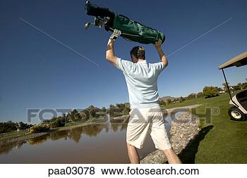Stock Photo - man throwing golf 
cart into lake. 
fotosearch - search 
stock photos, 
pictures, images, 
and photo clipart