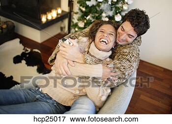 Picture - couple hugging 
on couch. fotosearch 
- search stock 
photos, pictures, 
images, and photo 
clipart