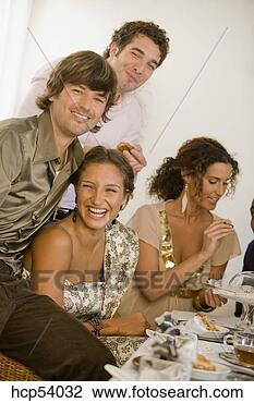 Stock Photo - friends laughing 
at dinner table. 
fotosearch - search 
stock photos, 
pictures, images, 
and photo clipart