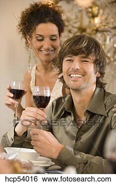 Stock Photo - man drinking wine 
at dinner table 
with friends. 
fotosearch - search 
stock photos, 
pictures, images, 
and photo clipart