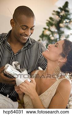 Stock Photography - man giving his 
girlfriend a gift. 
fotosearch - search 
stock photos, 
pictures, images, 
and photo clipart
