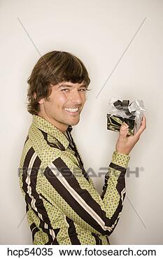 Stock Image - man holding gift. 
fotosearch - search 
stock photos, 
pictures, images, 
and photo clipart