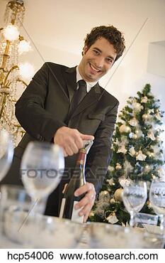 Stock Photo - man opening bottle 
of wine. fotosearch 
- search stock 
photos, pictures, 
images, and photo 
clipart