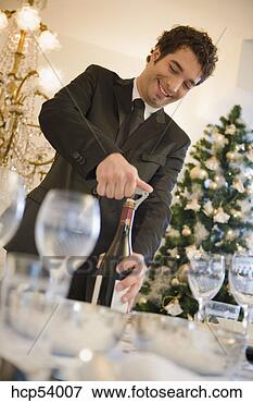 Picture - man opening bottle 
of wine. fotosearch 
- search stock 
photos, pictures, 
images, and photo 
clipart
