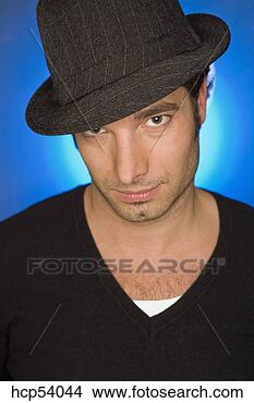 Stock Photo - man wearing hat. 
fotosearch - search 
stock photos, 
pictures, images, 
and photo clipart