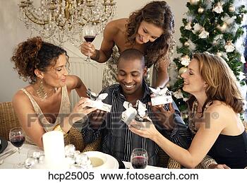 Stock Image - people exchanging 
gifts at christmas 
party. fotosearch 
- search stock 
photos, pictures, 
images, and photo 
clipart