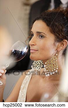 Stock Photo - woman drinking 
wine at dinner 
party. fotosearch 
- search stock 
photos, pictures, 
images, and photo 
clipart