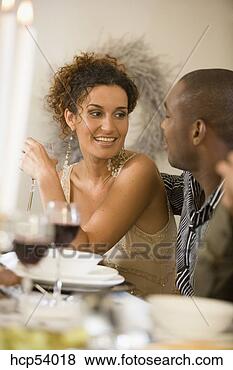 Stock Photo - woman talking 
at dinner table. 
fotosearch - search 
stock photos, 
pictures, images, 
and photo clipart