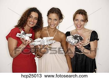 Stock Photo - women holding 
christmas gifts. 
fotosearch - search 
stock photos, 
pictures, images, 
and photo clipart