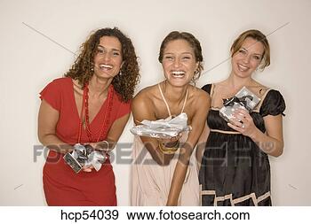 Stock Photograph - women holding 
christmas gifts. 
fotosearch - search 
stock photos, 
pictures, images, 
and photo clipart