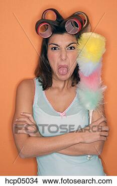 Stock Photo - defiant woman 
in curlers holding 
duster. fotosearch 
- search stock 
photos, pictures, 
images, and photo 
clipart