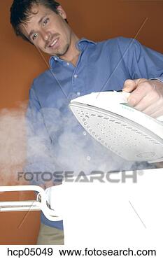 Stock Photograph - man ironing clothes. 
fotosearch - search 
stock photos, 
pictures, images, 
and photo clipart
