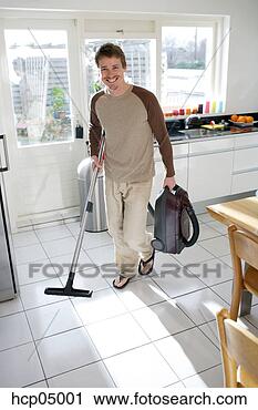 Arquivo de Fotografia - vacuuming,  cozinha, 
 chão. fotosearch 
- busca de fotos, 
imagens e clipart