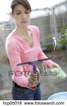 Stock Photo - woman cleaning 
window. fotosearch 
- search stock 
photos, pictures, 
images, and photo 
clipart