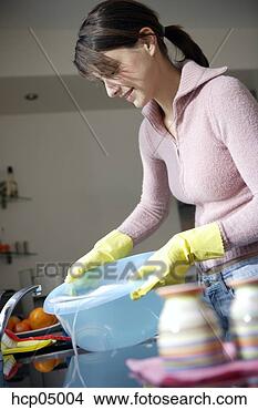 Stock Photo - woman emptying 
water into sink. 
fotosearch - search 
stock photos, 
pictures, images, 
and photo clipart