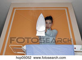 Stock Photo - woman ironing 
clothes. fotosearch 
- search stock 
photos, pictures, 
images, and photo 
clipart
