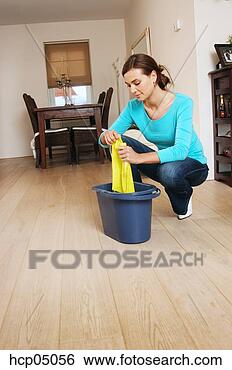 Stock Photo - woman wringing 
out rag. fotosearch 
- search stock 
photos, pictures, 
images, and photo 
clipart