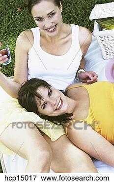 Picture - woman relaxing 
on friend. fotosearch 
- search stock 
photos, pictures, 
images, and photo 
clipart