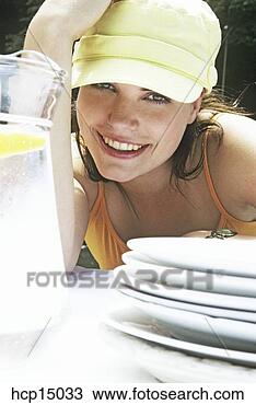 Stock Photo - woman smiling 
at table. fotosearch 
- search stock 
photos, pictures, 
images, and photo 
clipart