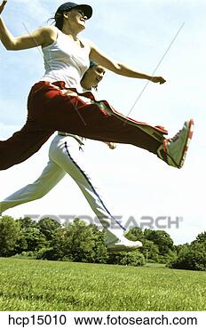 Stock Photography - women jumping. 
fotosearch - search 
stock photos, 
pictures, images, 
and photo clipart