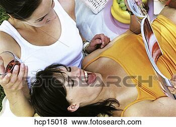 Stock Photo - women reading 
magazine and laughing. 
fotosearch - search 
stock photos, 
pictures, images, 
and photo clipart